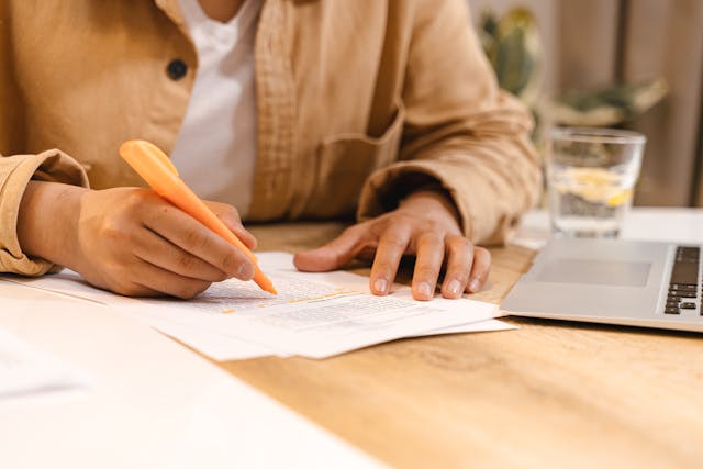 woman signing papers