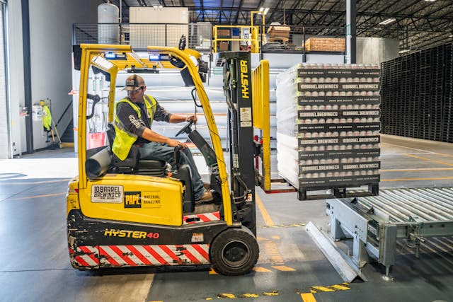 man driving forklift